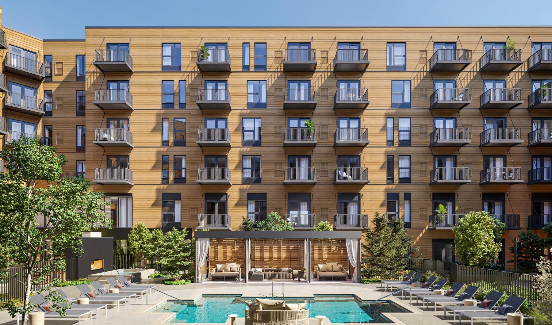 a large building with a pool in front of it